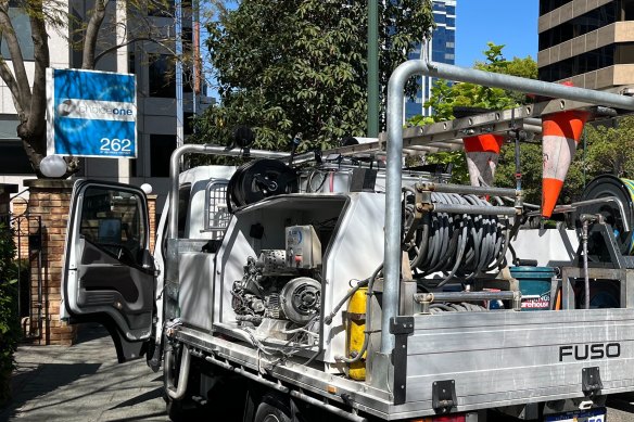 The damage to the truck carrying an industrial pressure cleaner.