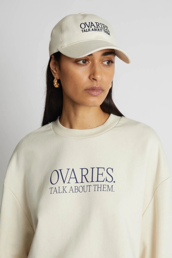 Camilla & Marc’s Ovarian Cancer collection includes a sweatshirt, cap and tote bag.