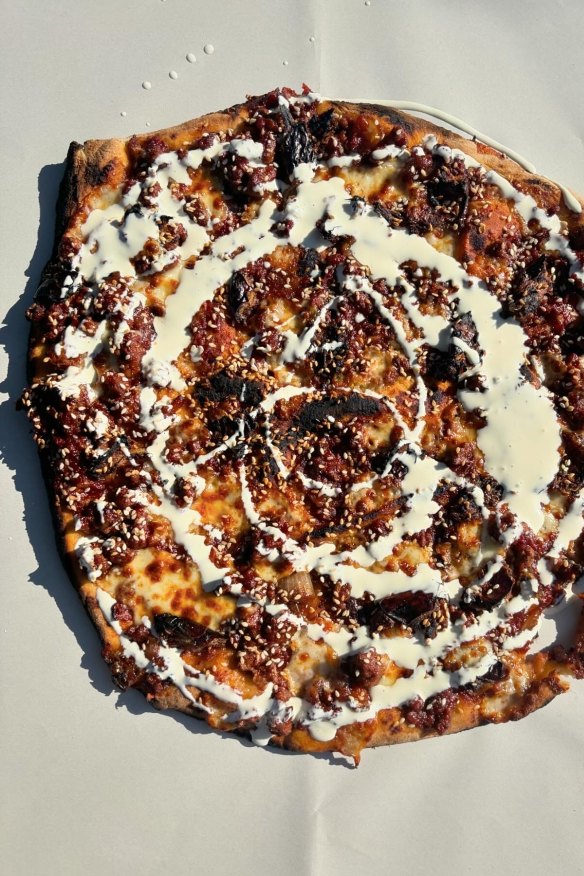 Bolognese, date and sesame mayo pizza at Calzone Zone.