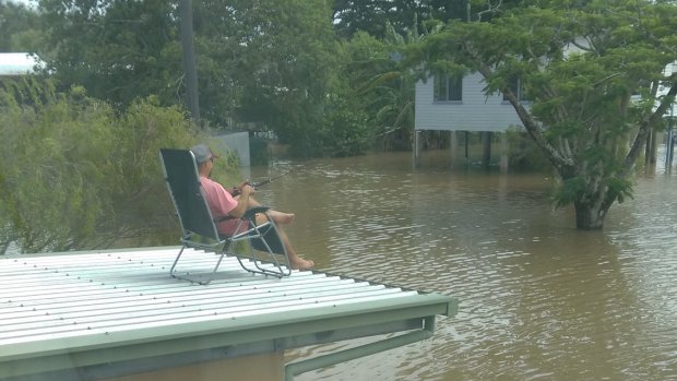 A local in Ingham taking advantage of the north Queensland floods. 