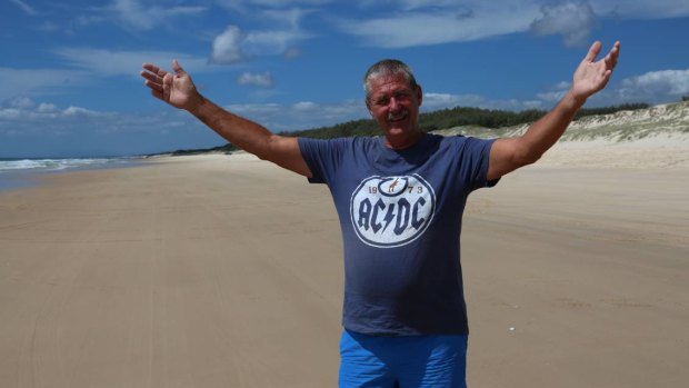 Dave Thelander, known as Barefoot Dave stands between the most easterly points in Queensland and Australia, pointing out that they are just 32km apart.