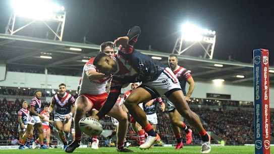 Daniel Tupou scores the Roosters' opening four-pointer.