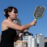 Sydneysiders make the most of long summer nights and daylight savings to play pickleball at House of Pickle, on the roof of the International