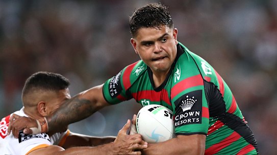 Two men have been charged after allegedly abusing Latrell Mitchell via social media.