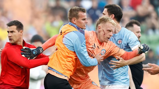 Melbourne City goalkeeper Tom Glover was left bleeding and concussed after fans stormed the pitch on December 17.