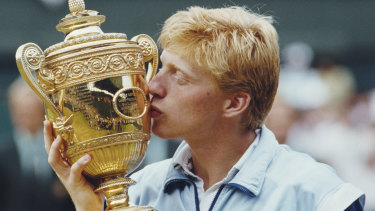 Boris Becker kisses the Wimbledon trophy after beating Kevin Curren in the 1985 final at just 17.