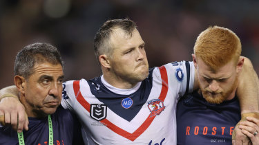 A devastated Brett Morris leaves the field injured after suffering a serious knee injury.