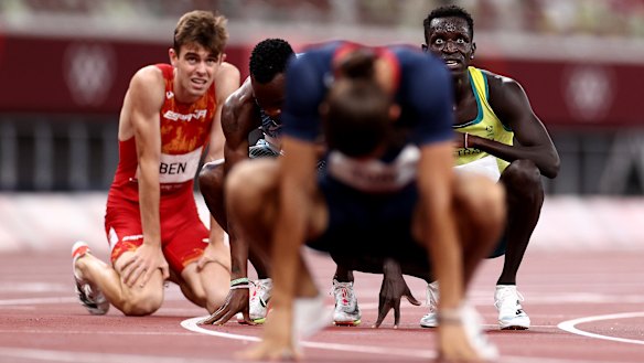 Spent ... Peter Bol, right, after finishing fourth in the Olympic 800m final.