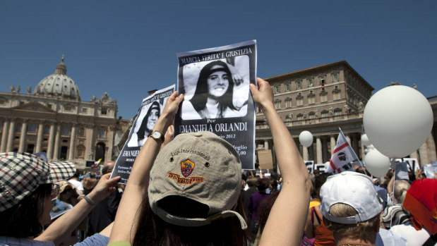 Demonstrators hold pictures of Emanuela Orlandi in St. Peter's Square in 2012. 