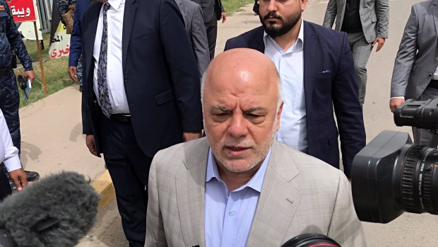Iraq Prime Minister Haider al-Abadi speaks to reporters after casting his ballot in the country's parliamentary elections in Baghdad on  Saturday.