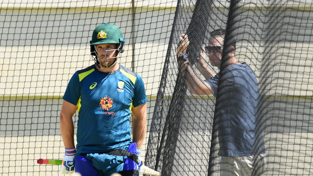 Helping hand: Australian opener Aaron Finch speaking to former captain Ricky Ponting in Perth yesterday.