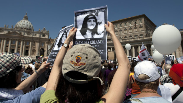 Demonstrators hold pictures of Emanuela Orlandi in St. Peter's Square in 2012. 