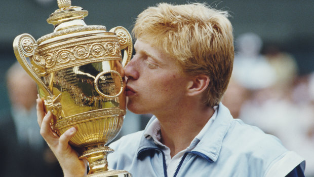 Boris Becker kisses the Wimbledon trophy after beating Kevin Curren in the 1985 final at just 17.