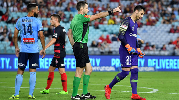 Pivotal: the Wanderers were leading 1-0 before Vedran Janjetovic was sent off against Sydney FC but fell to a 3-1 loss.
