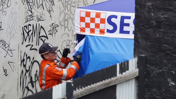 SES workers were seen covering a vehicle on Celestial Avenue.