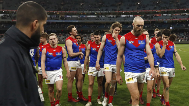 A dejected Melbourne leave the MCG.