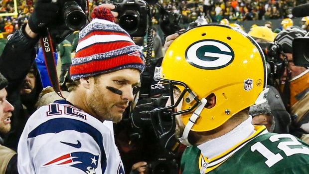 New England Patriots quarterback Tom Brady (left) and Green Bay Packers quarterback Aaron Rodgers after their lone matchup in 2014. 