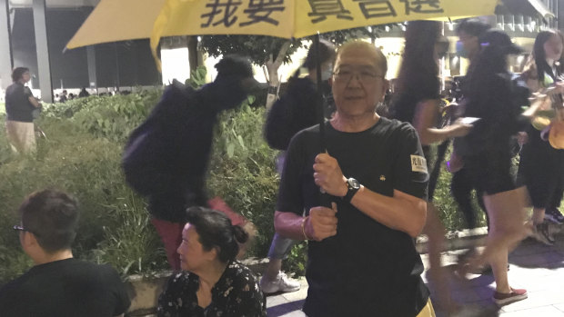 Mr Ko with his handpainted umbrella during a rally at Tamar Park to mark the fifth anniversary of the Umbrella Movement.