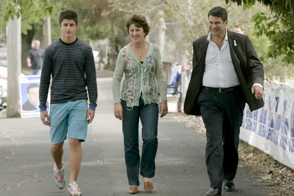 Nick Bracks with his parents in 2006.