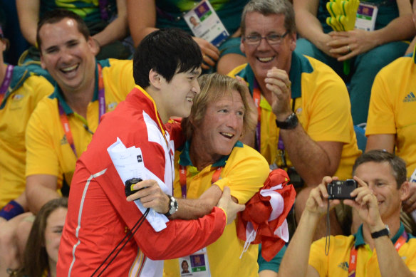 China’s Sun Yang hugs Australian coach Denis Cotterell after winning gold in London.