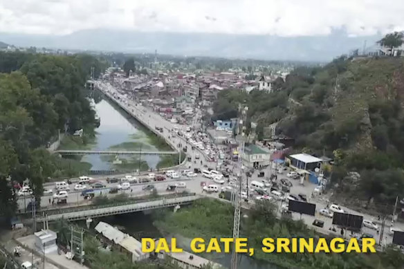 This frame-grab from a video released on August 10, 2019, by the Jammu and Kashmir government purports to show life returning to normal at Dal Gate in Srinagar, Indian-controlled Kashmir.  