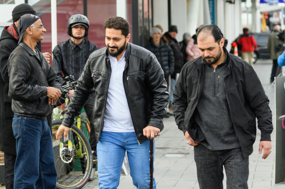 Al Noor Mosque shooting survivor Wasseim Alsati (centre) leaves Christchurch High Court during Brenton Tarrant's sentencing hearing on Monday morning.