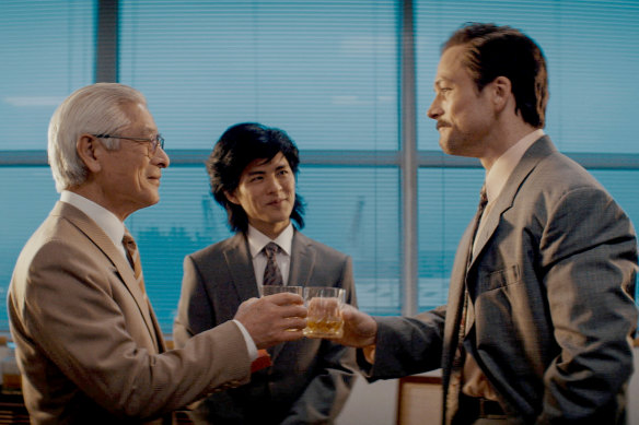 Togo Igawa (left), Nino Furuhata and Taron Egerton attempt to seal the deal in Tetris.