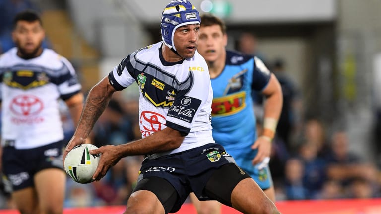 Always inspired: Johnathan Thurston directs play against the Titans with the same aplomb that has characterised his career.