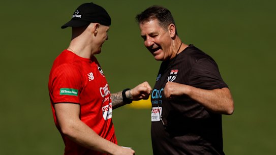 Zak Jones and Ross Lyon share a laugh at a recent St Kilda training session.