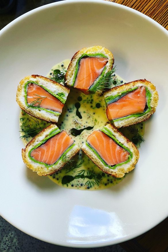 Salmon, wrapped in crab meat, herb gallete and brioche.