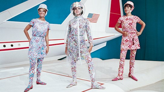 Hostesses model 1970s Pucci uniforms in front of Lockheed's supersonic transport full-size mockup.