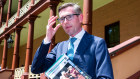 Treasurer  Dominic Perrottet carrying the freshly printed 2020-21 NSW Budget Papers into Parliament House.