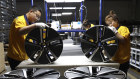 Workers at a wheel hub factory in Binzhou city. 