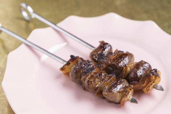 The go-to dish: chargrilled duck hearts wrapped in guanciale.