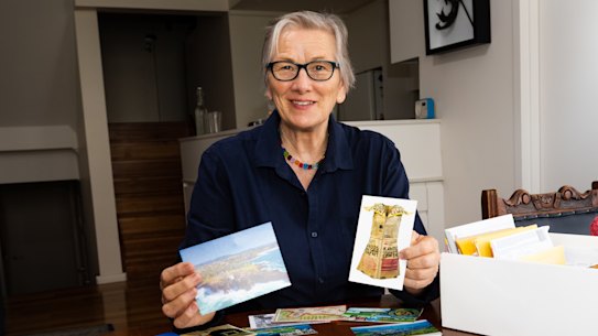 Manly branch president Diana Whitton with some of the CWA postcards.