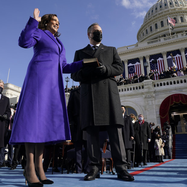 Kamala Harris takes the oath of office on January 20 with her husband, Doug Emhoff, by her side.