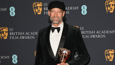 Troy Kotsur with his award for best supporting actor for CODA. 