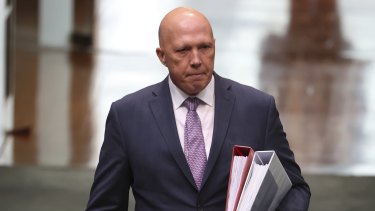 Home Affairs Minister Peter Dutton approved funding for two projects in a marginal seat before the funding guidelines were available.