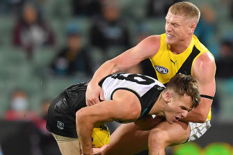 Josh Caddy, right, tackles Port's Robbie Gray. 