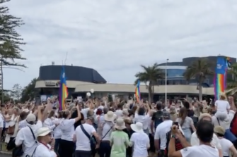 Protesters gather in Coolangatta on Friday morning. The heavily intertwined cross-border community has been host to a number of demonstrations against vaccines, lockdowns and travel restrictions in recent months.