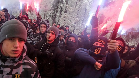Volunteers with the right-wing paramilitary Azov National Corps rally in front of the Ukrainian parliament on Monday.