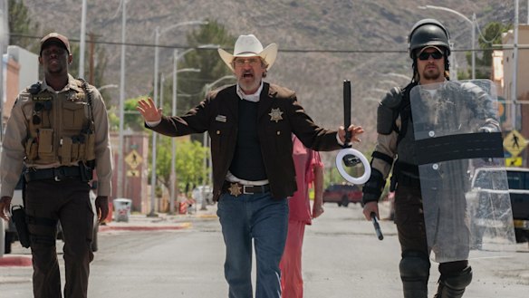 Joaquin Phoenix (centre) is the sheriff trying to maintain order in Eddington.
