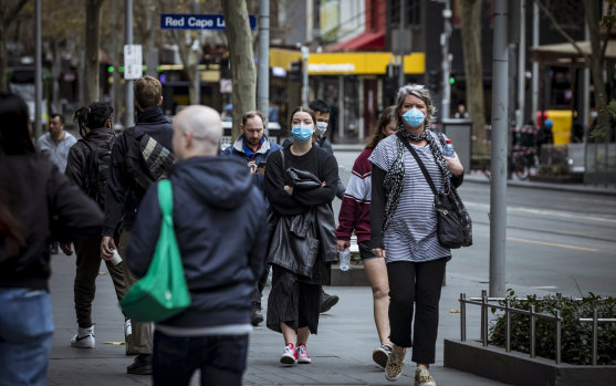 Melbourne residents wear masks before they became mandatory in July.