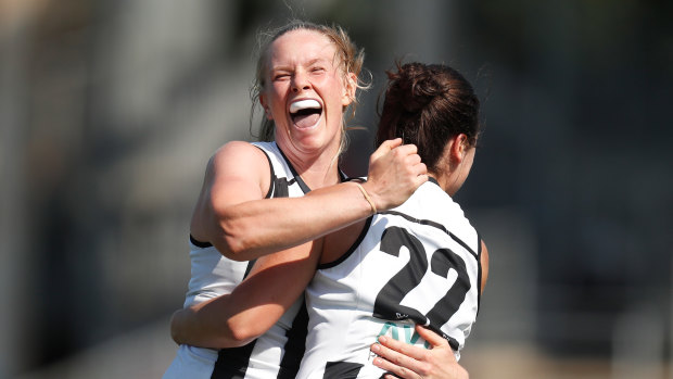 Sarah D'Arcy and Sophie Casey celebrate a goal.