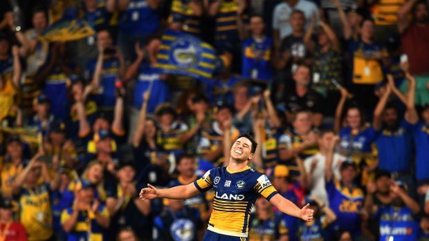 Two weeks is a long time in football: Mitchell Moses celebrates a try as the Eels christen Bankwest Stadium in style.