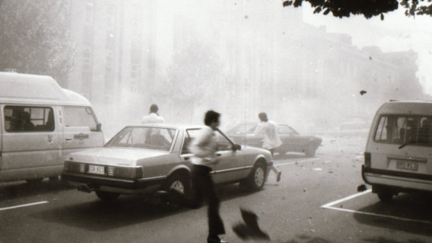 Bystanders run from the scene of the explosion.