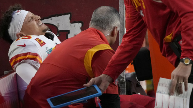Chiefs quarterback Patrick Mahomes in pain on the sideline.