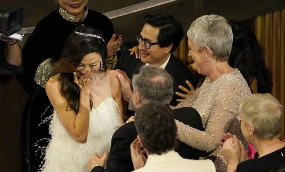 Leading lady Michelle Yeoh rects in the audience as she is declared the winner of the best actress Oscar for her performance in Everything Everywhere All at Once.