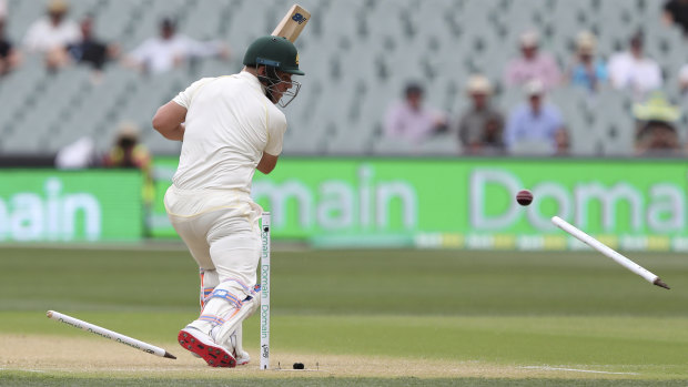 Shattered: Not a pleasant view for Aaron Finch as he surveys the carnage.