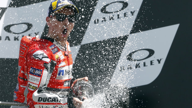 Ducati's Jorge Lorenzo celebrates his victory in the  Italian MotoGP grand prix.